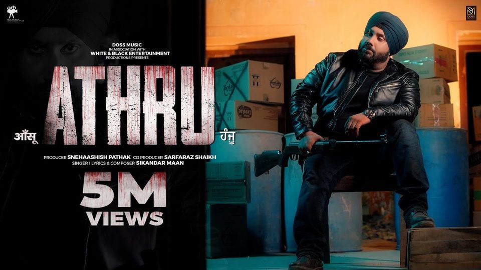 ATHRU artwork: Sikandar Maan seated with a rifle beside the title ATHRU, with the production credits and the words 5M views